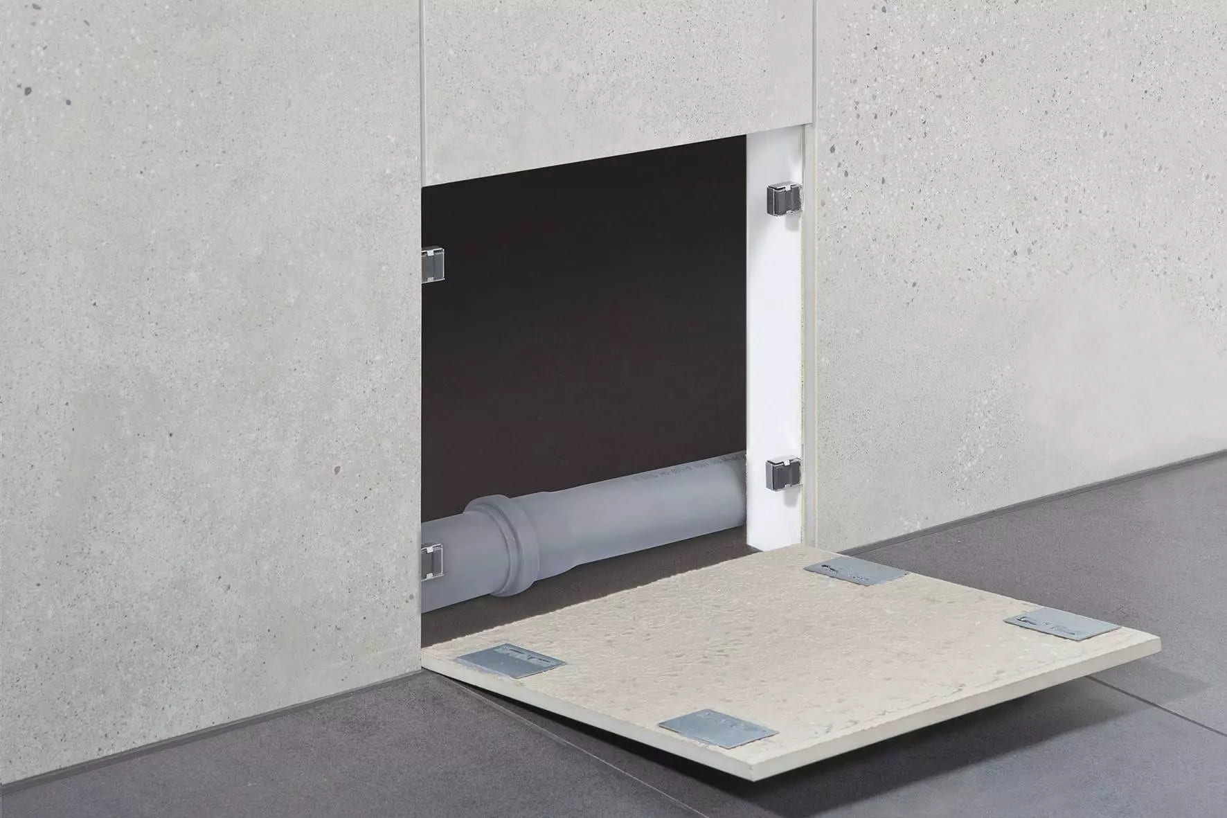 Sistema para o fecho invisível de aberturas de inspeção Schlüter-REMA Sistema para o fecho invisível de aberturas de inspeção